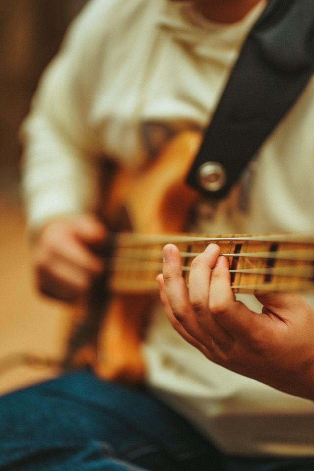 Hands on a bass during a take