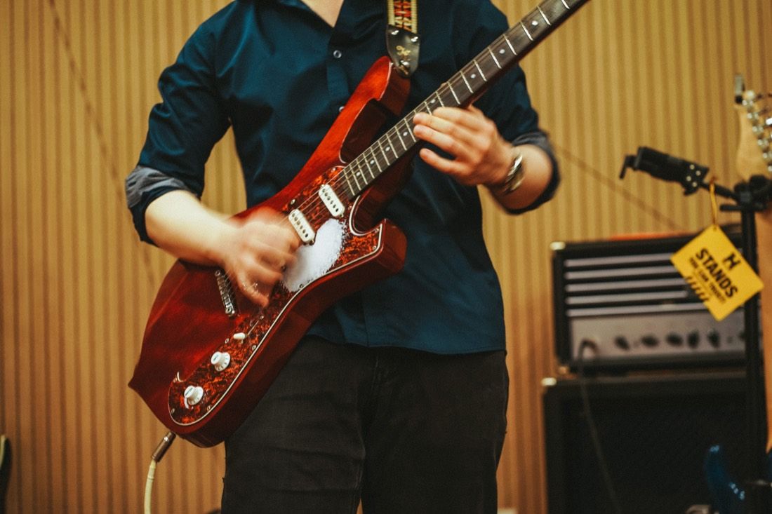 A guitarist mid-session